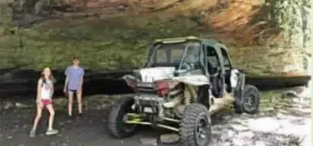 Four wheeler parked under a cliff