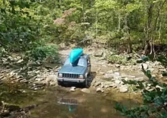 Jeep about to cross a creek