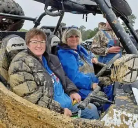People on a four wheeler
