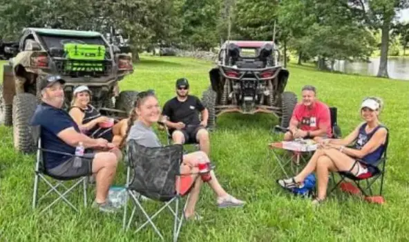 People sitting on foldable chairs