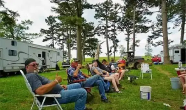 People sitting on foldable chairs