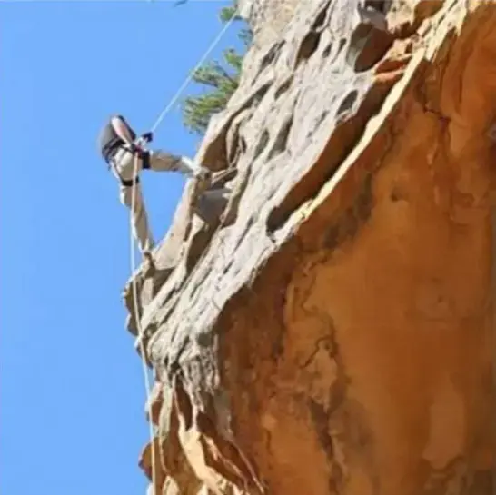 Repelling down a cliff