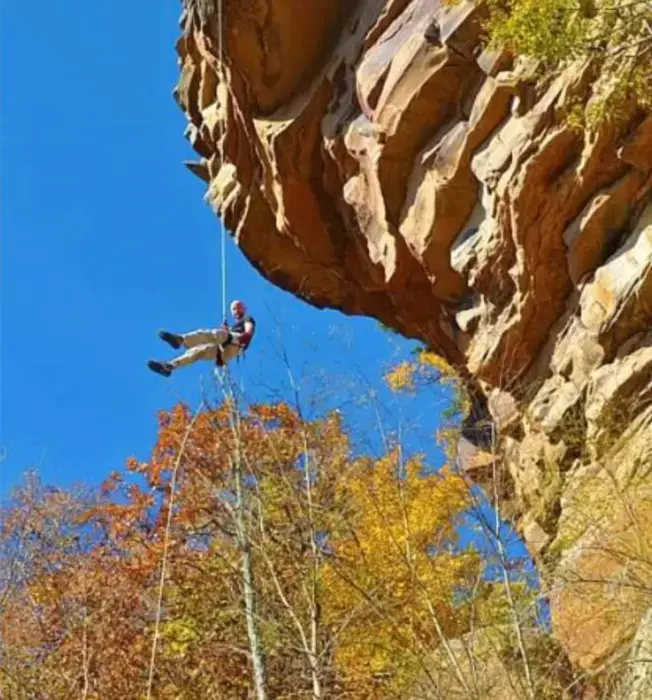 Repelling down a cliff