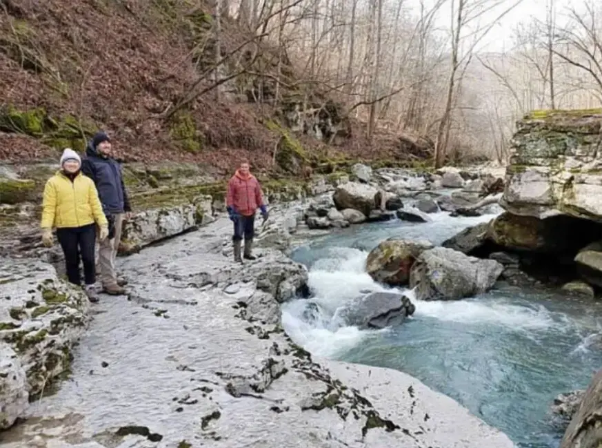 Standing next to a running river
