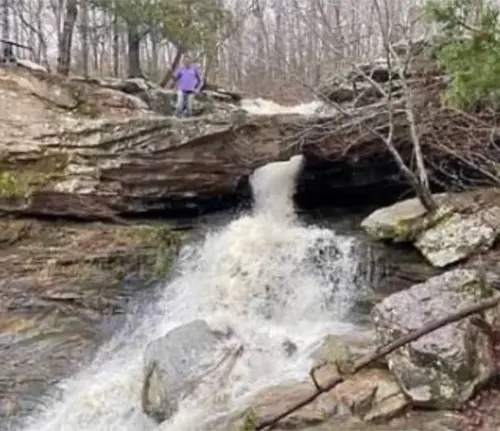 Water falling through a hole in a big rock